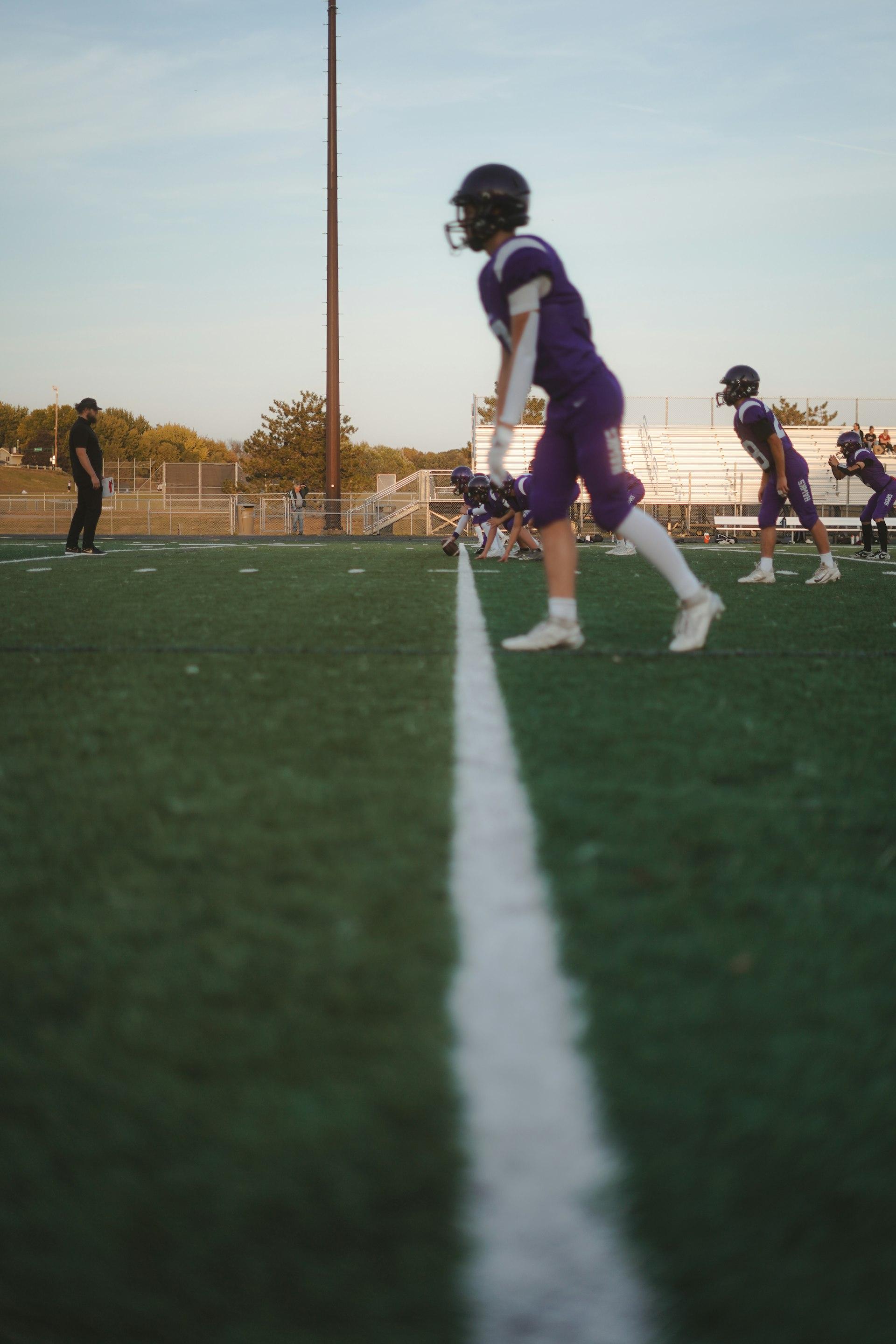 Stock still: high-school practice at golden hour. Replace with real training footage.